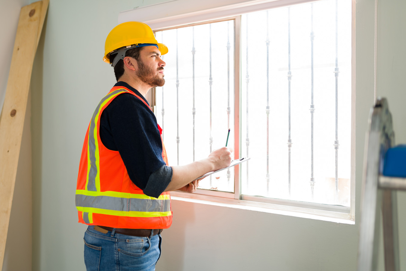 Professional contractor looking at the construction details