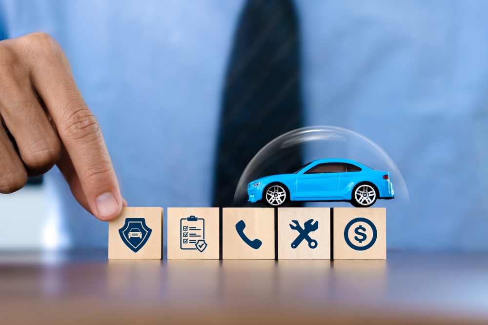 Car,Insurance,Services,Concept.businessman,Agent,Holding,Wooden,Block,And,Car