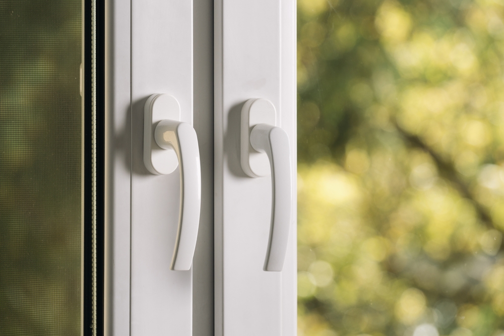 Close,Up,Shot,Of,Closed,Pvc,Window,With,Plastic,Handles.